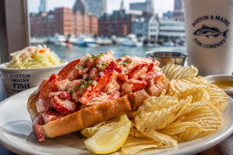 New England lobster roll with a harbor view